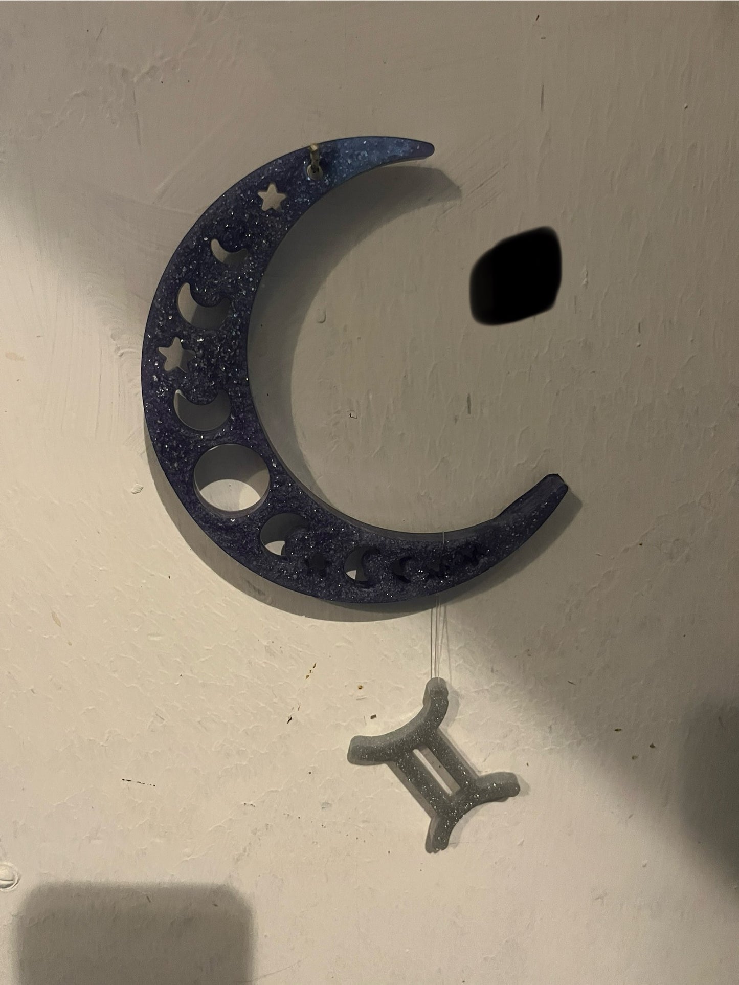 Gemini horoscope hanging from the moon