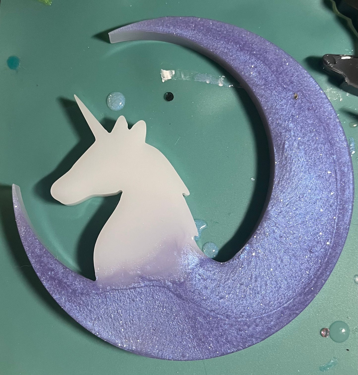 White unicorn on a purple moon