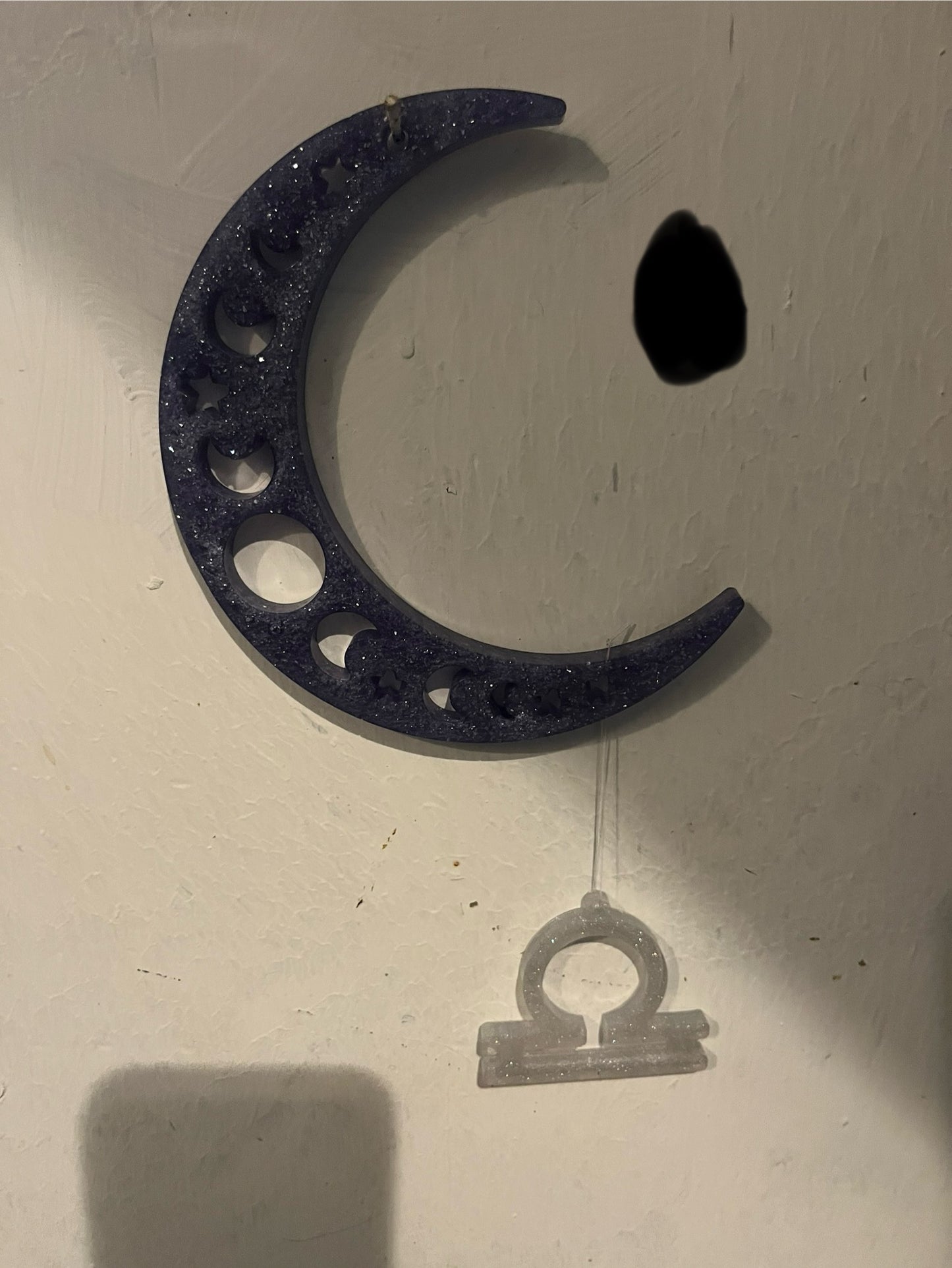 Libra horoscope hanging from the moon