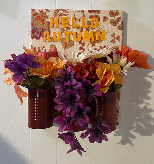 Autumn sign with fake flowers
