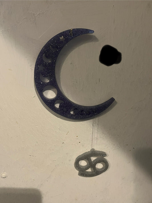Cancer horoscope hanging from the moon