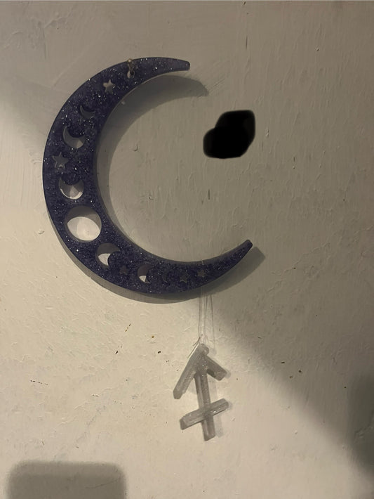 Sagittarius horoscope hanging from the moon