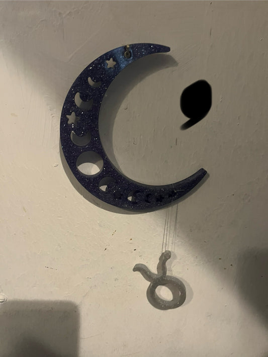 Taurus horoscope hanging from the moon