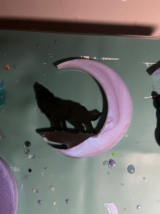 Black wolf on a purple moon