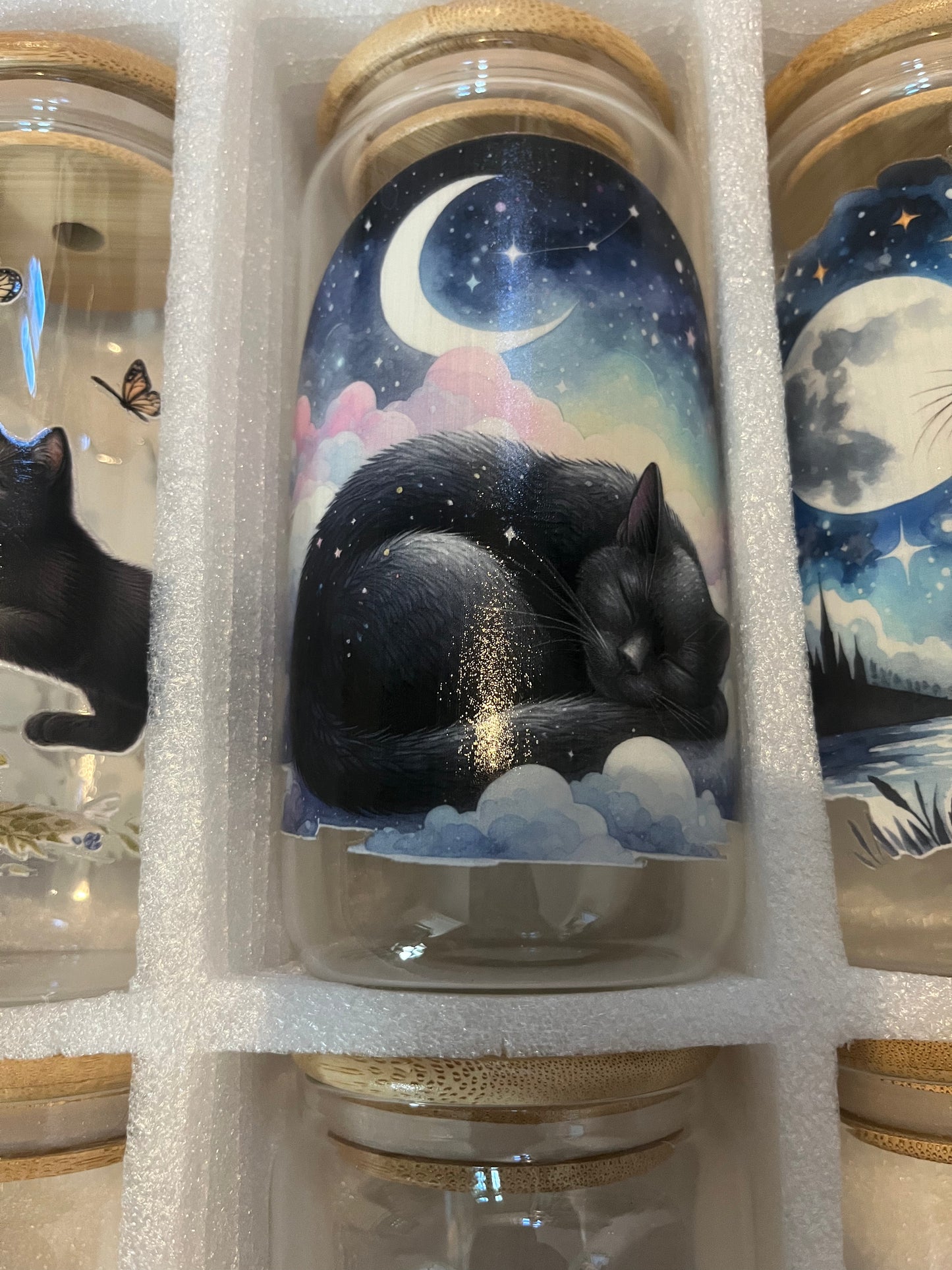 Sleeping kitty with 1/4 moon drinking glass