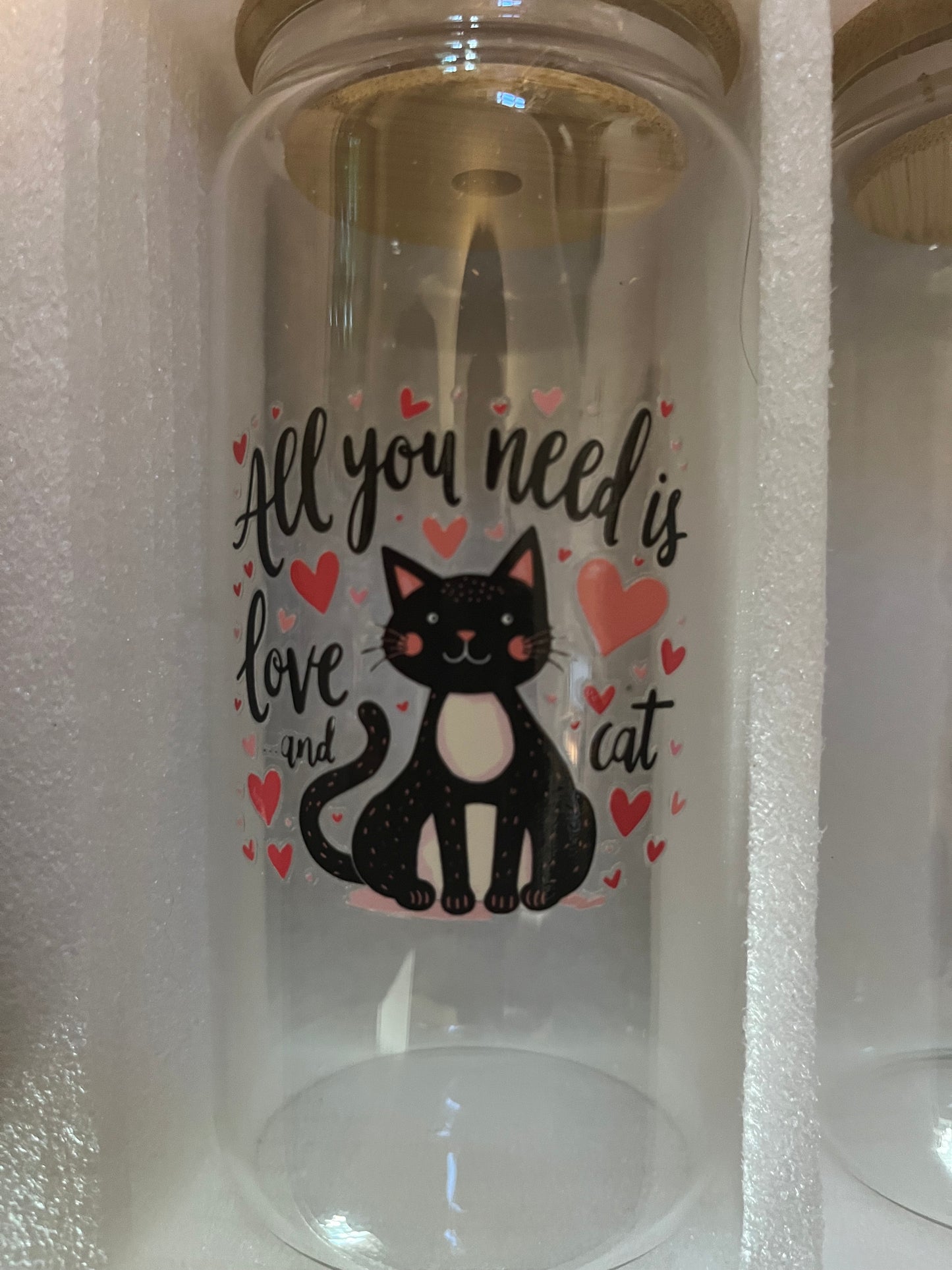 All you need is love and a cat drinking glass