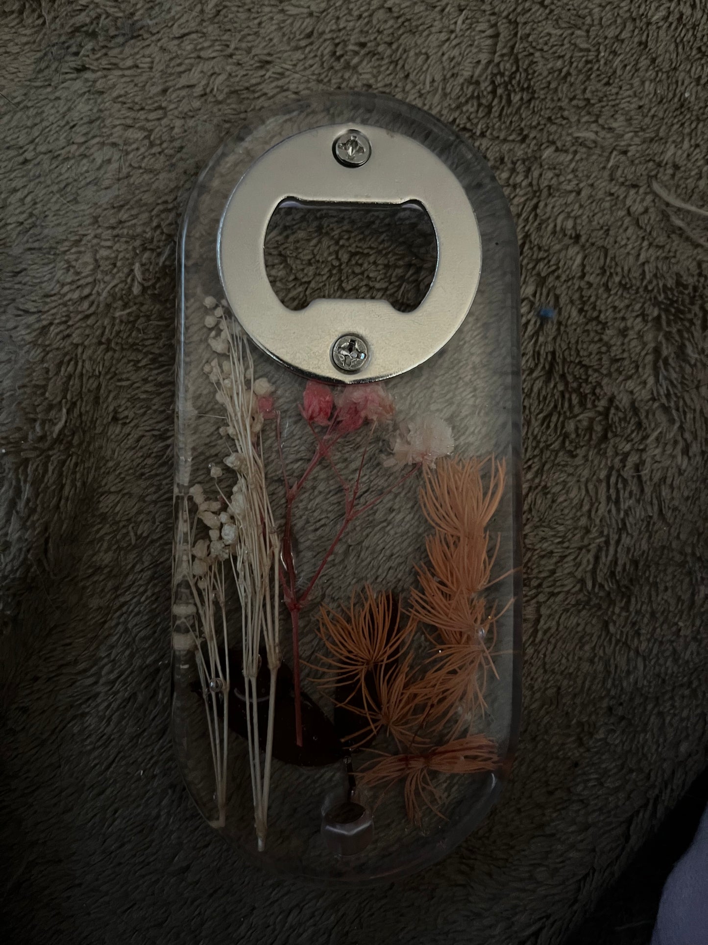 Resin bottle opener with dried flowers